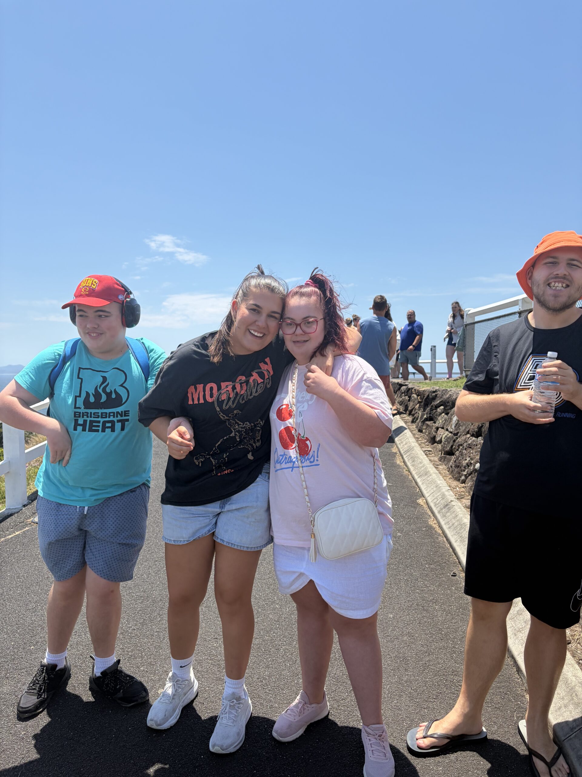 Participants and a support worker at a coastal lookout